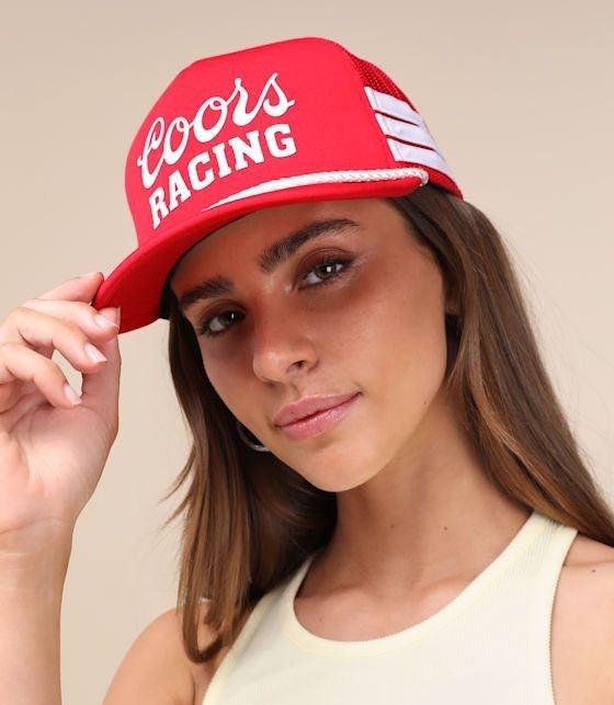women wearing red trucker hat