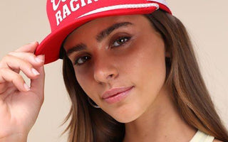 women wearing red trucker hat