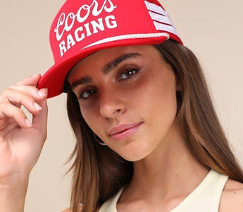 women wearing red trucker hat