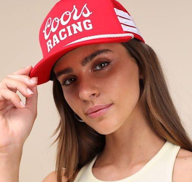 women wearing red trucker hat