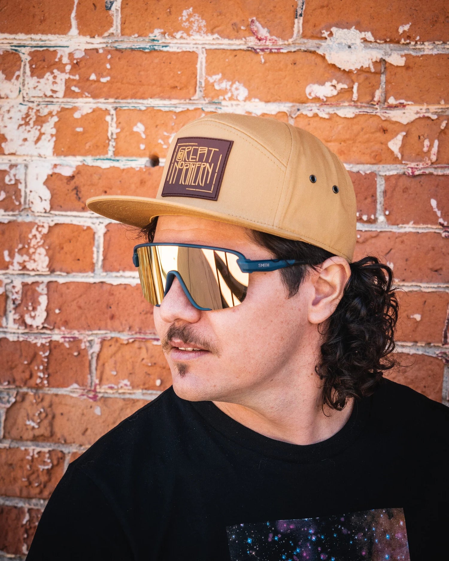 men wearing 7 panel hats with patch on it