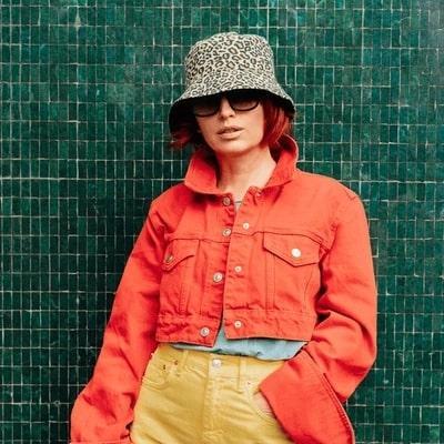women wearing a fashion bucket hat and streetwear clothes