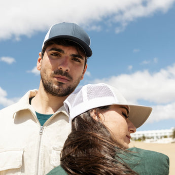 men & women wearing a trucker hat by fushia