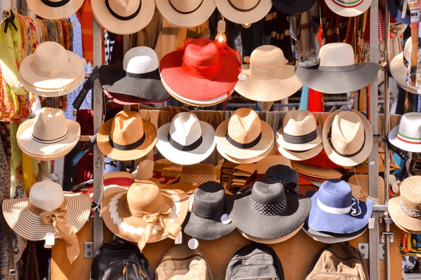 many hats displayed on rack