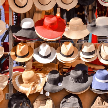 many hats displayed on rack