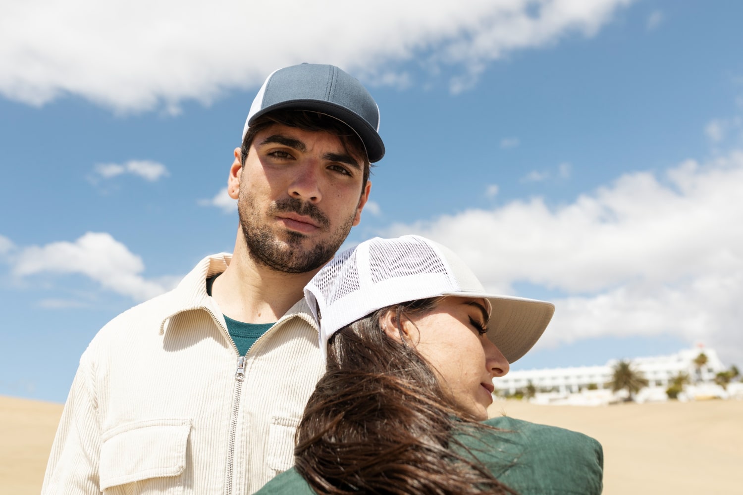 Men & Women wearing a trucker hat by fushia